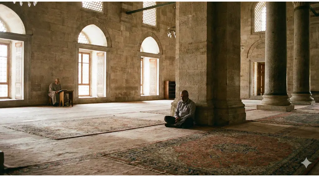 A Muslim man sitting silently in a grand mosque, demonstrating the proper etiquette of I'tikaf through quiet contemplation and reverence.
