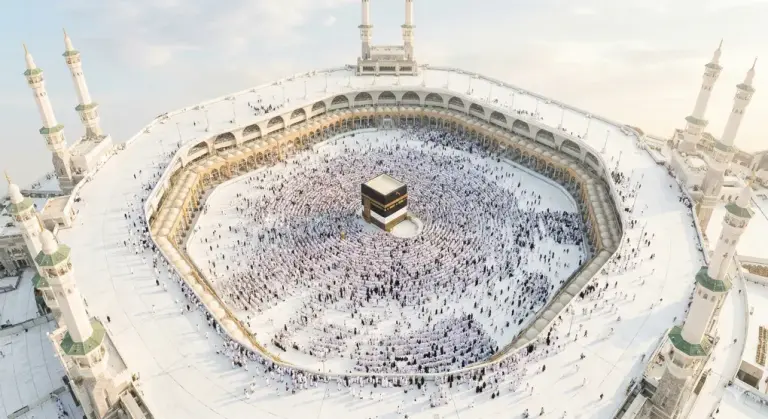 Shafi'i School of Jurisprudence: The Complete Guide to Islamic Law, Prayers, and Tasawuf 1 Wisdom of Hajj: Thousands of pilgrims wearing white ihram garments performing tawaf around the Kaaba in Masjid al-Haram.